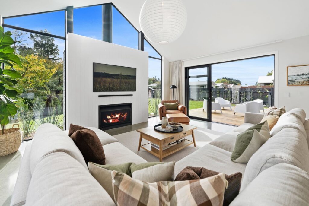 Living room with fireplace opening to the garden